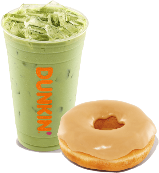 Iced matcha latte in a branded cup from a coffee and donut franchise with a glazed donut.