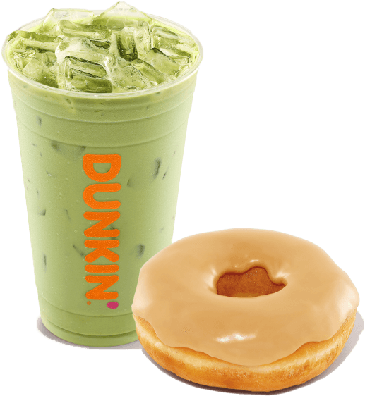 A green iced beverage in a plastic cup with "Dunkin" written on it, showcased beside a beige-glazed doughnut from the beloved coffee and donuts franchise.